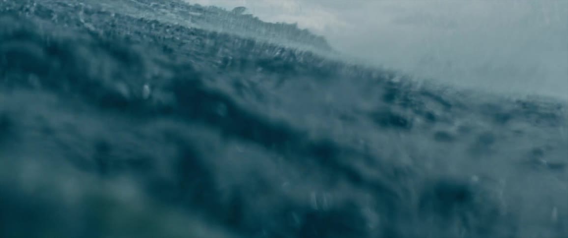 Blue ocean waves near the coast on an overcast day