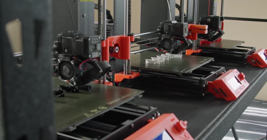 A view of 3d printers making plastic pieces