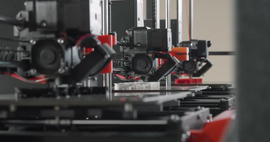 Three 3d printers printing side by side