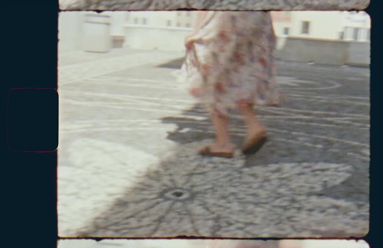Woman wearing a dress spins playfully