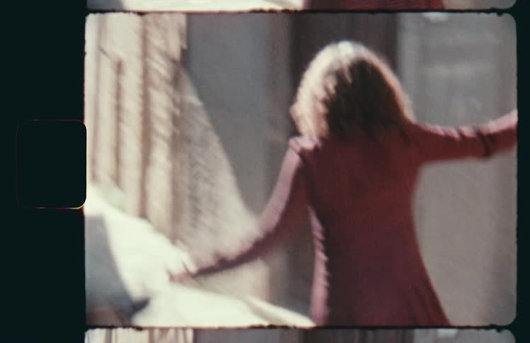 A woman dances in the alley