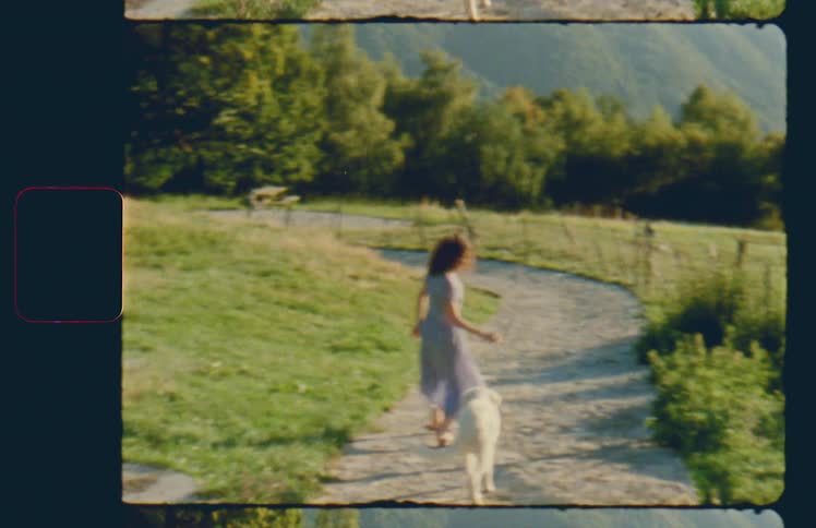 A young girl walks outside with her dog