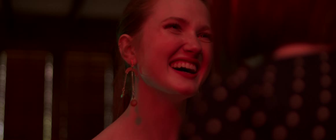A woman laughing at something funny