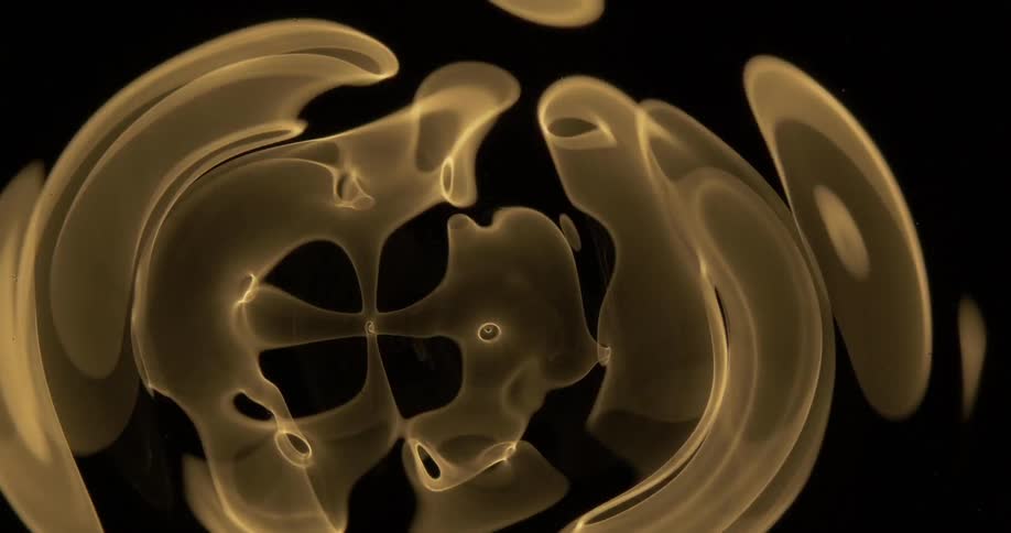 A glowing circle spins and grows larger into a swirling pattern