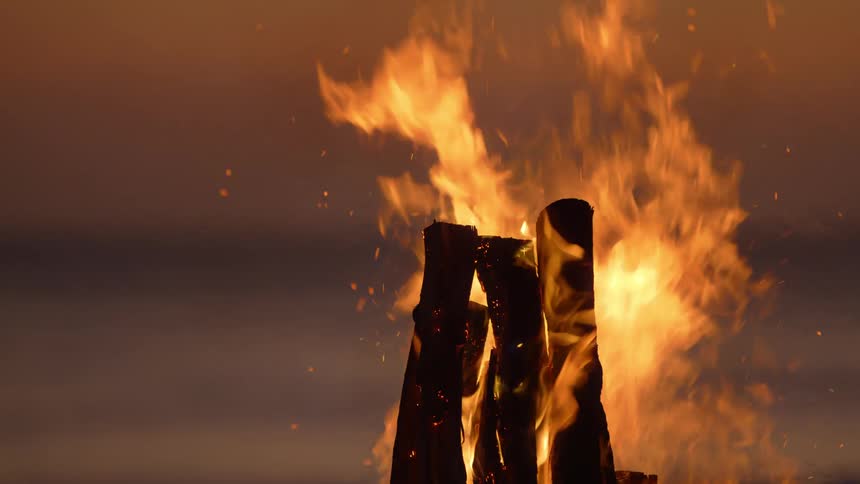 The wood is burning at sunset