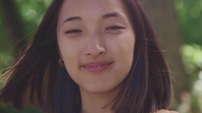 A close up image of a woman outdoors