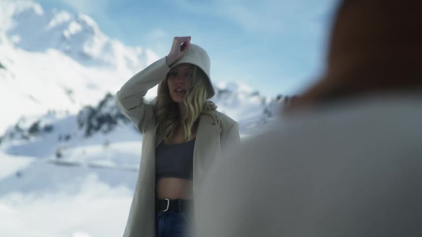 A woman posing outdoors in the snow