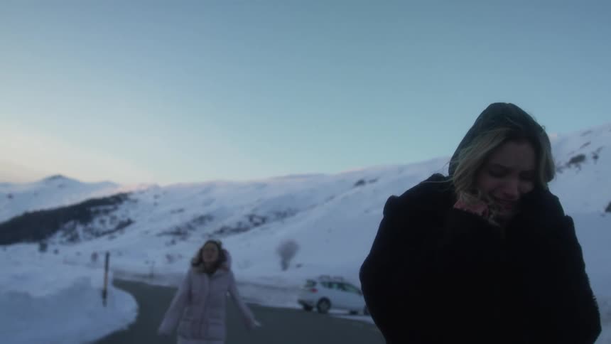 A woman chasing after a woman that is crying