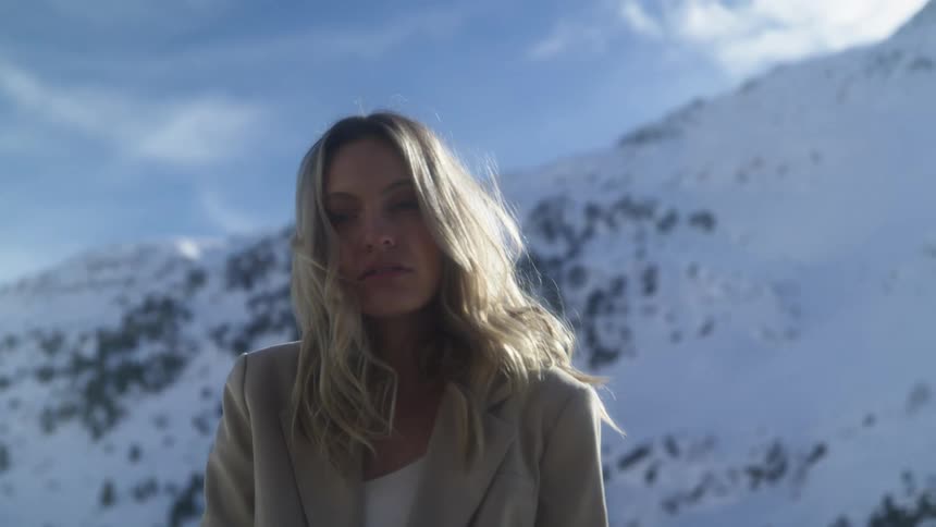 A woman that is standing outdoors during the winter