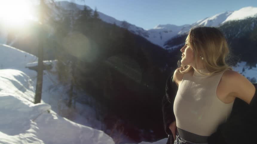 A woman that is hiking in a mountain outdoors