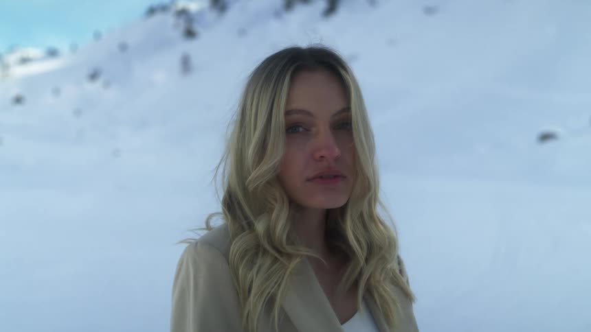 A woman standing out in a mountain area