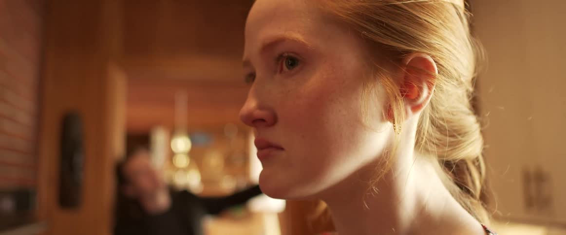 Sad young blonde woman having an argument at home