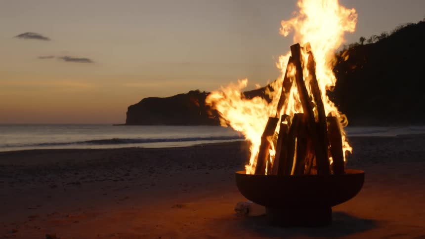 A bonfire is burning on the beach