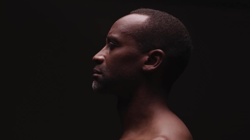 A portrait of the side of a mans head