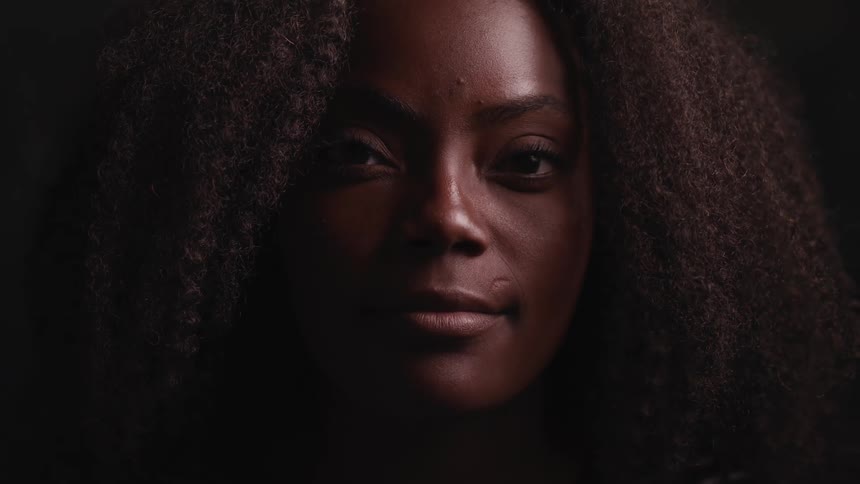 Close up of the face of a woman looking into the camera