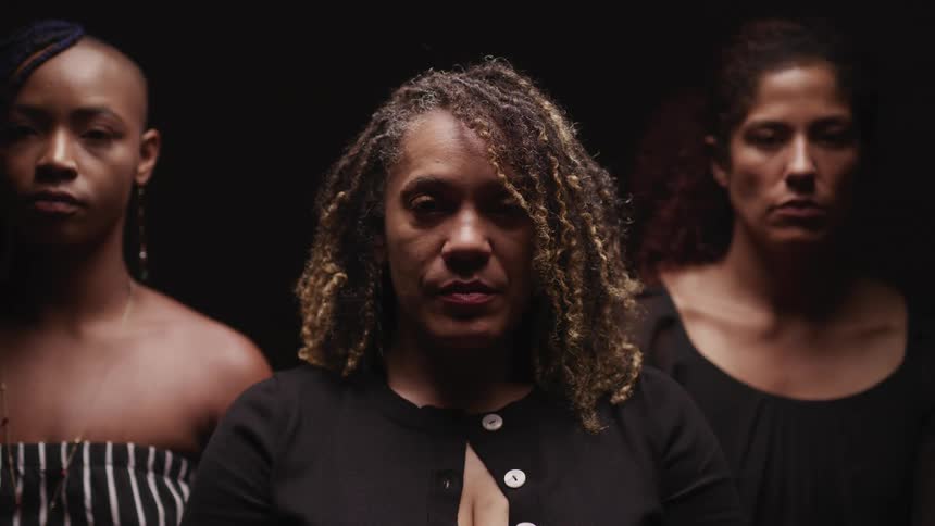 A portrait of three women posing