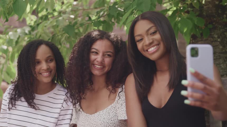A group of three girls taking a selfie