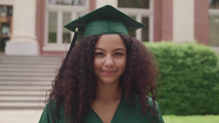 A portrait of a woman in graduation clothing