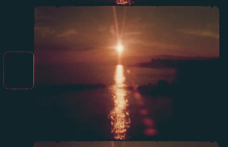 The sun is rising over the shore