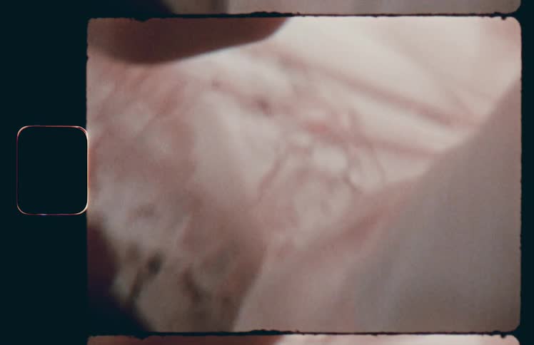 The woman pulls the fabric from her face