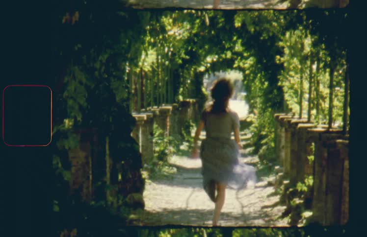 Woman in a dress runs on a path under the trees