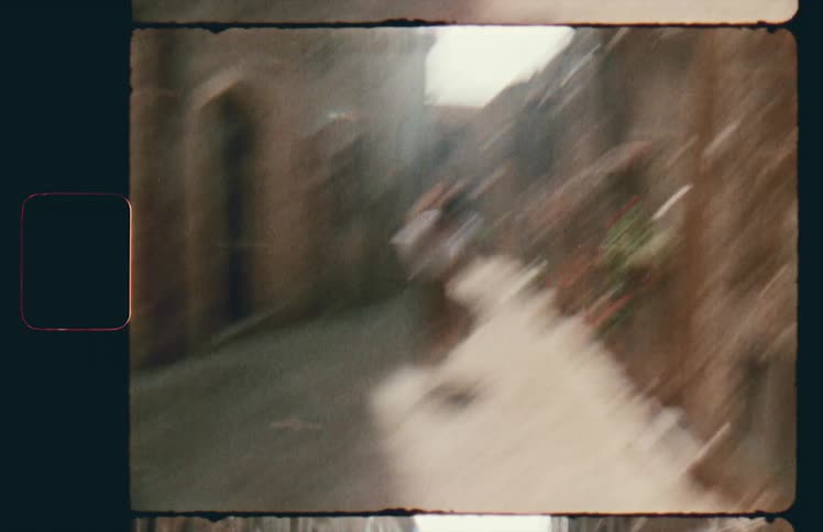 Woman flees through narrow paved alley past arched doorways