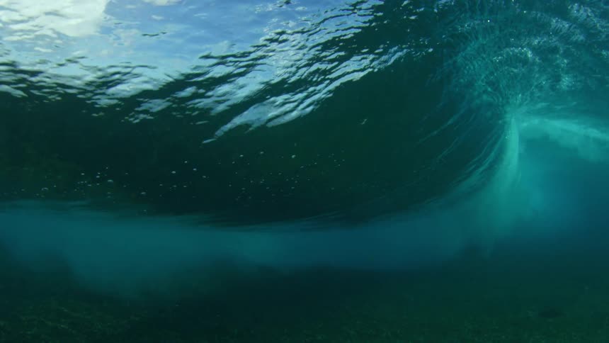 Rolling wave moves overhead near seafloor