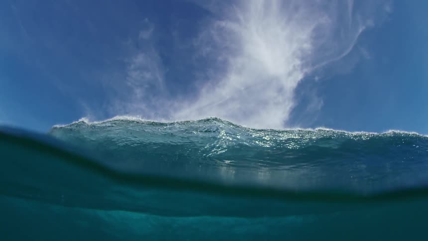 Huge wave rolls overhead and an underwater view