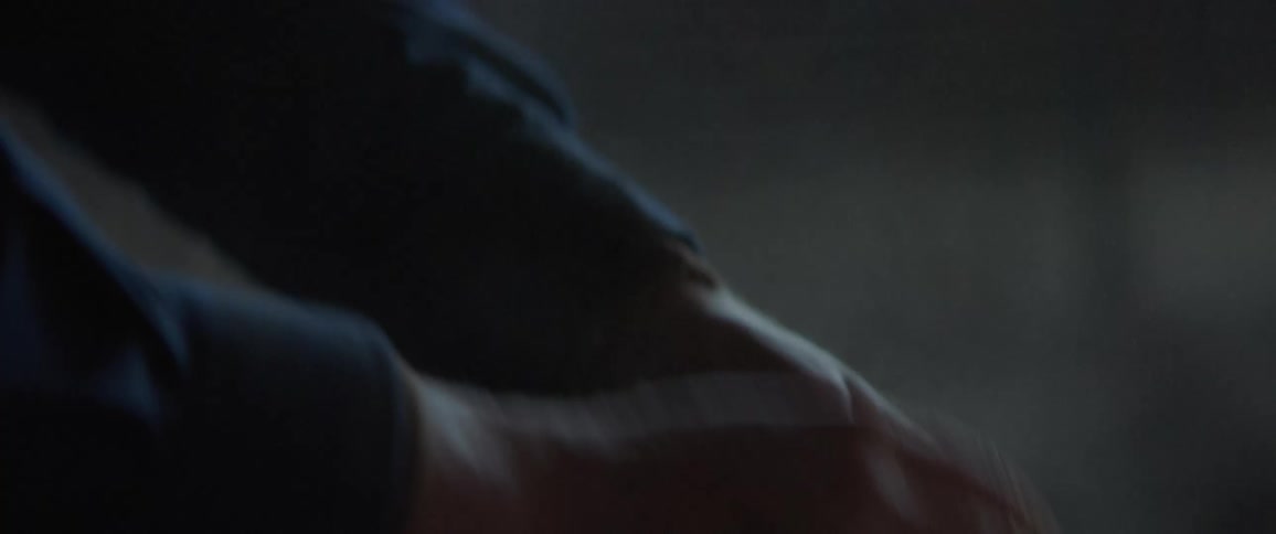 A person wiping dust on their hands