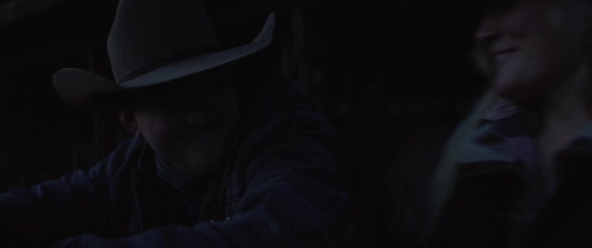 Cowboy and cowgirl greet each other before dawn
