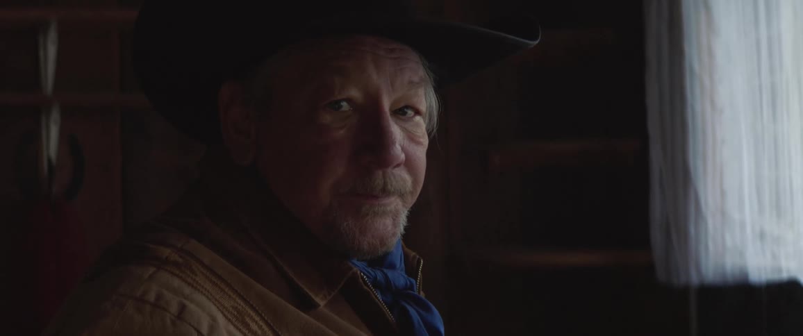 Elderly cowboy drinking coffee at home in the morning