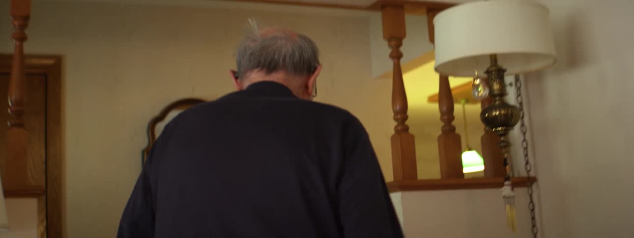 A man walking around in a house