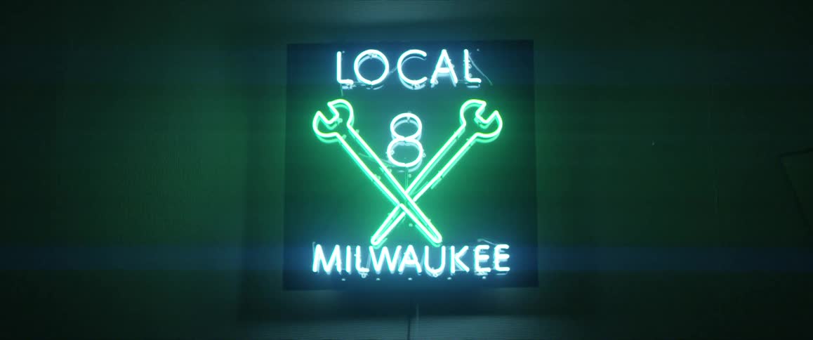 A glowing neon sign for a local union shop