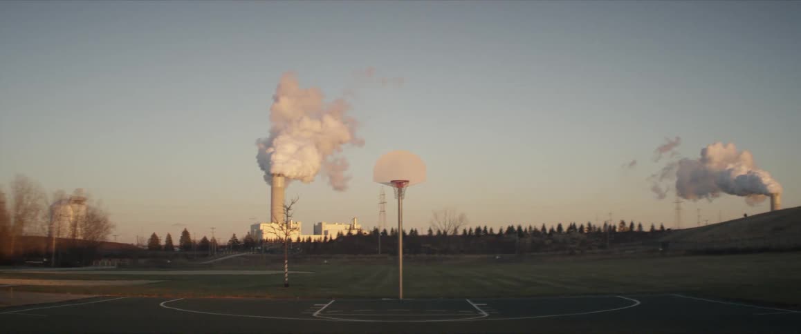 Smoke rising out of stacks at a factory
