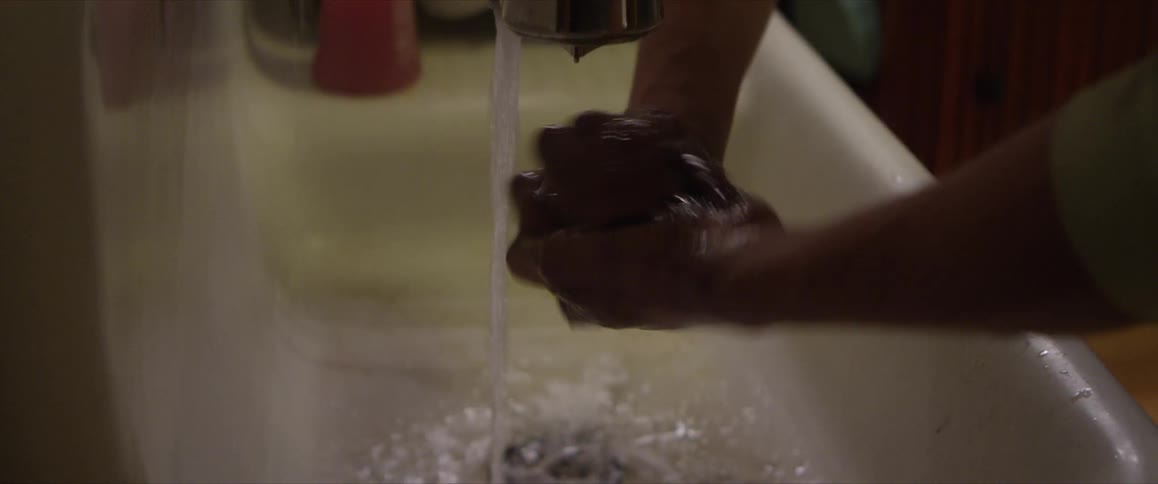 A person that is washing their hands