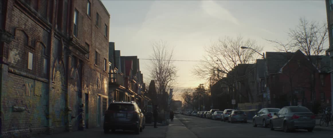 A road through a residential neighborhood in the evening