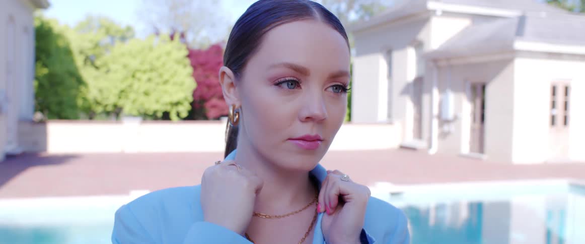 A close up portrait of a woman outside