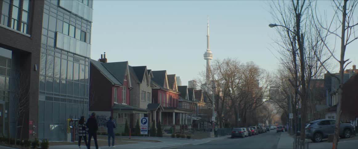 A road through a residential neighborhood in a city during the day