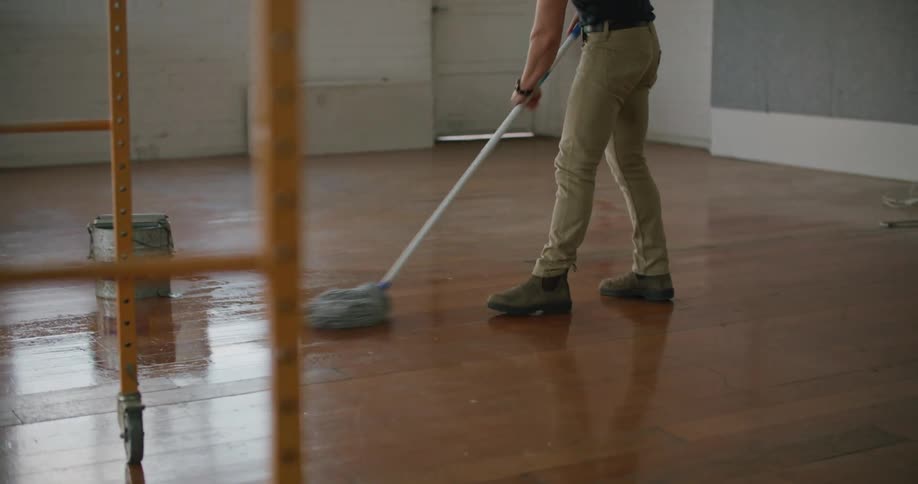 A man mopping a business