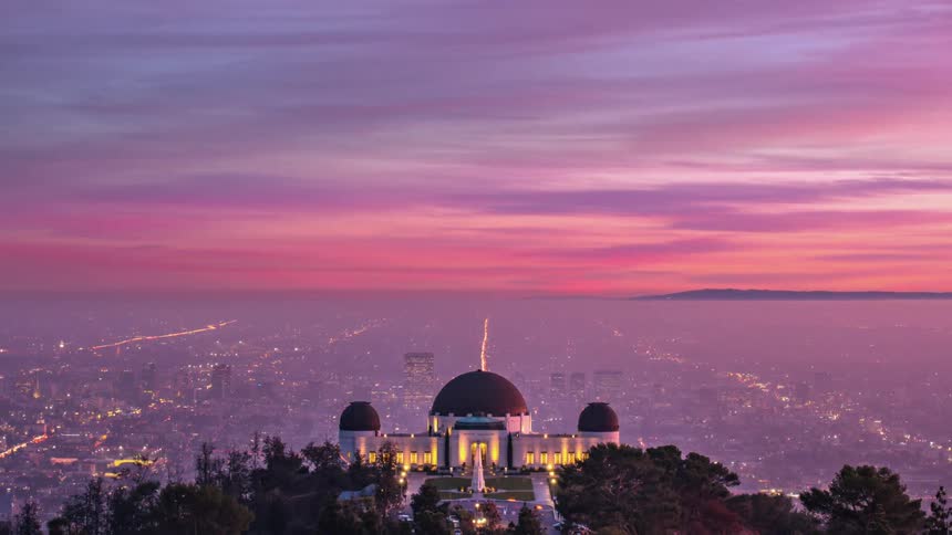 A time lapse of a sunset over a city