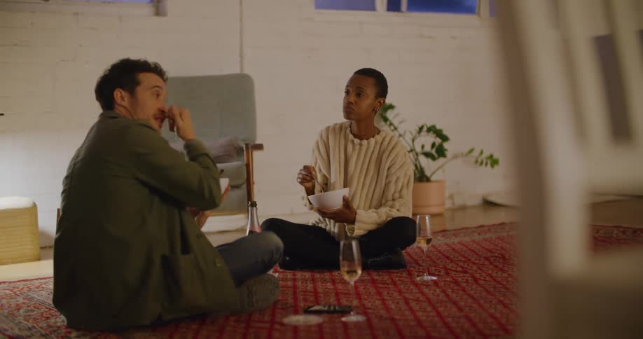 A man and woman eating food