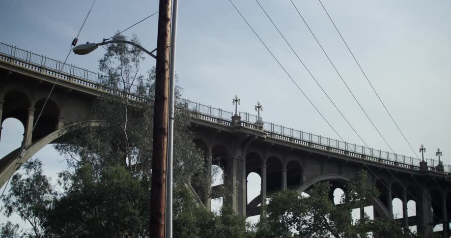 A bridge near a power line during the day