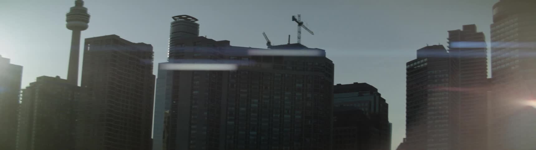 Sun shines brightly over city skyscrapers
