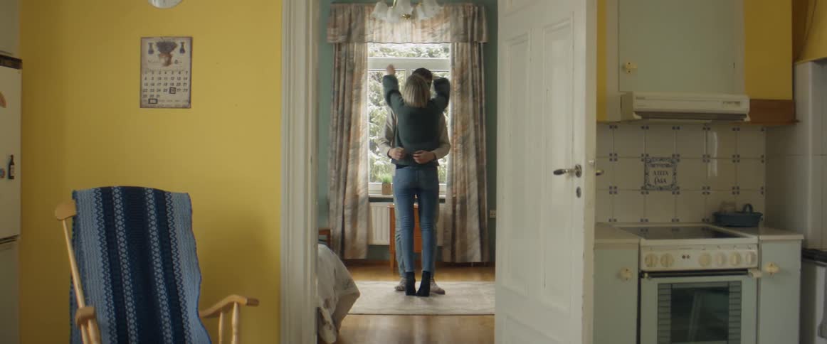 Blonde woman hides pregnancy test sharing news with husband then they hug