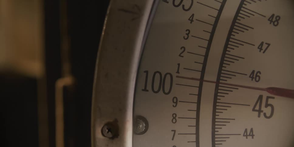 A needle moving on a number scale