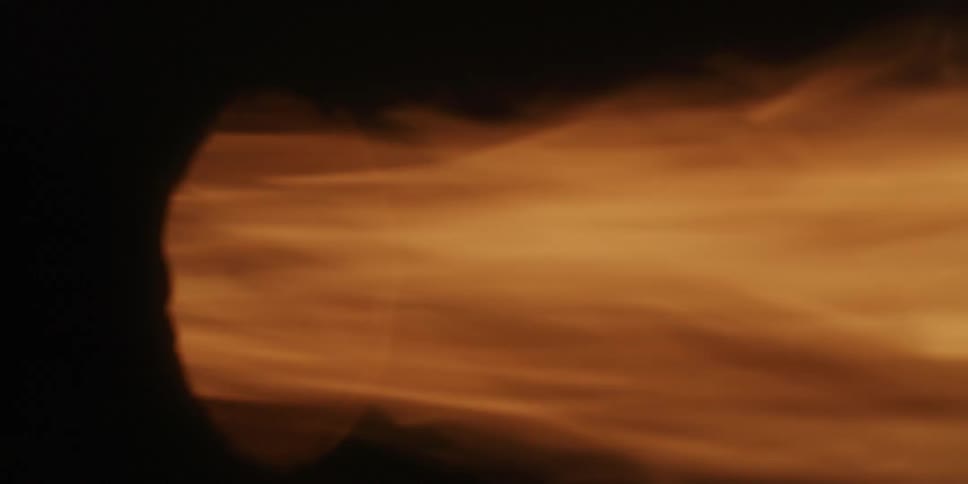 Black orange and yellow colors that look like a muffler with fire