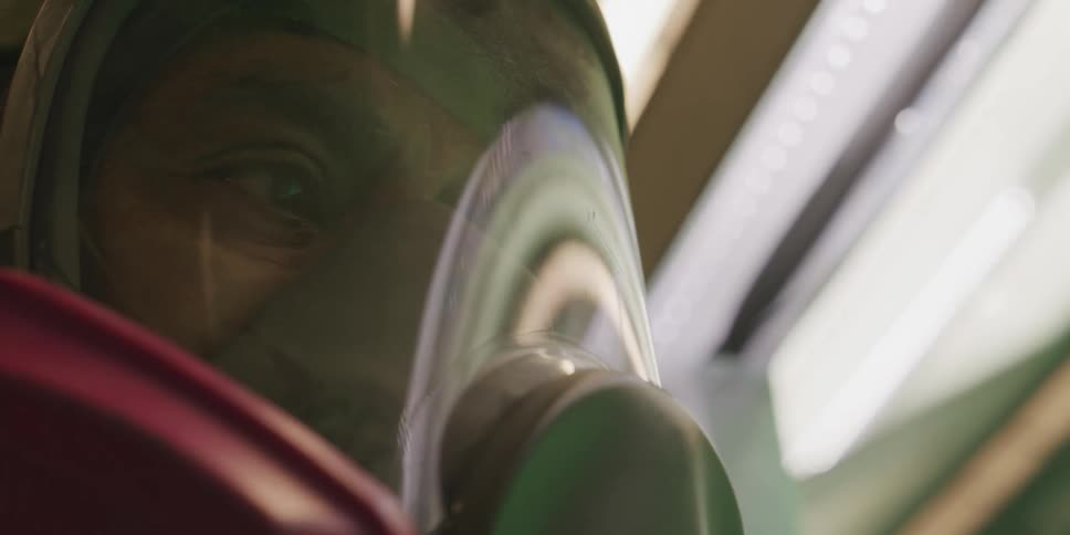 Close up of the face of a man wearing a protective mask