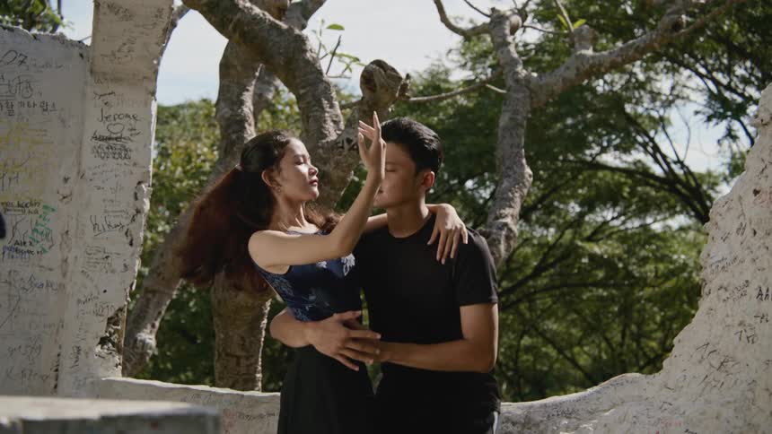 A male and female dancer dancing outdoors