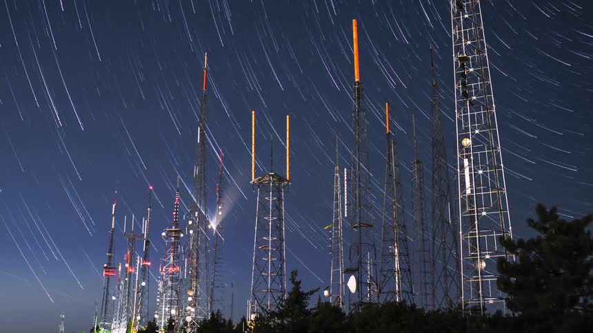 Bright lights flash on electrical towers