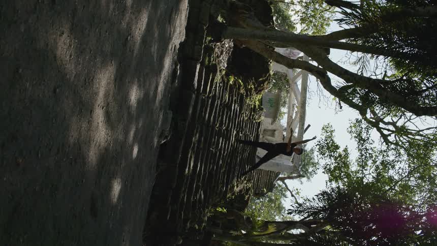 A male dancer jumping outside